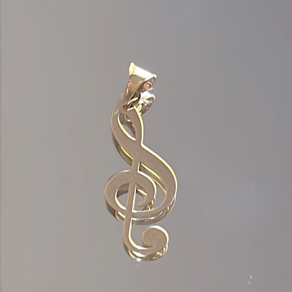18k solid gold music note pendant. Gold tone